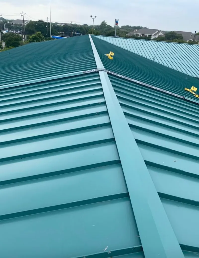 Green commercial metal roof ridge and valley for Metal Roof Repair in Youngsville